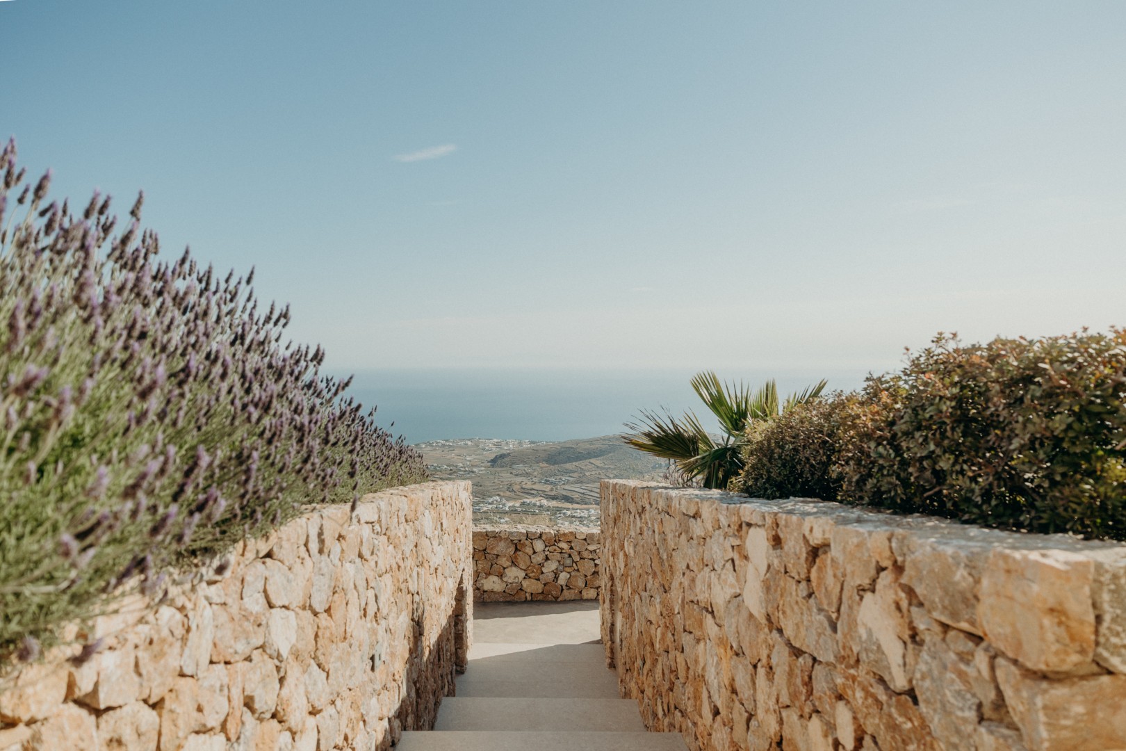 Arrival area at Santorini Sky with dry-stone walls